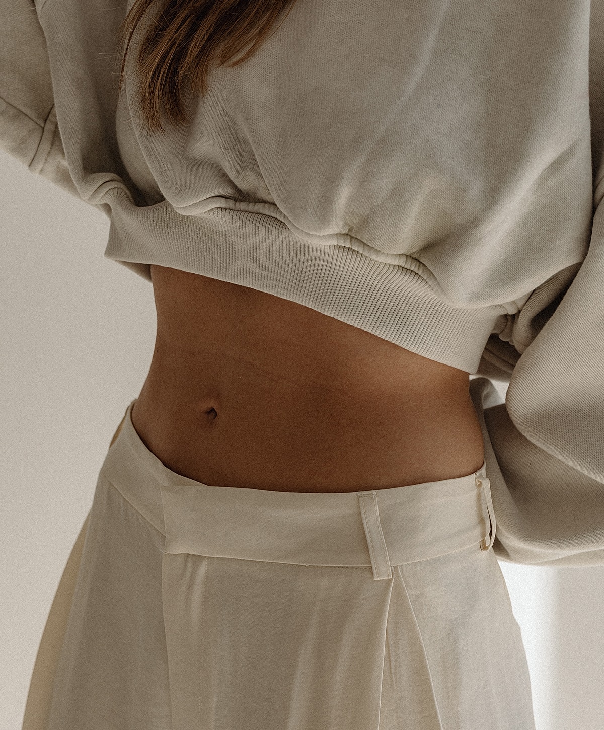 Casual outfit featuring a cropped sweatshirt and pants.