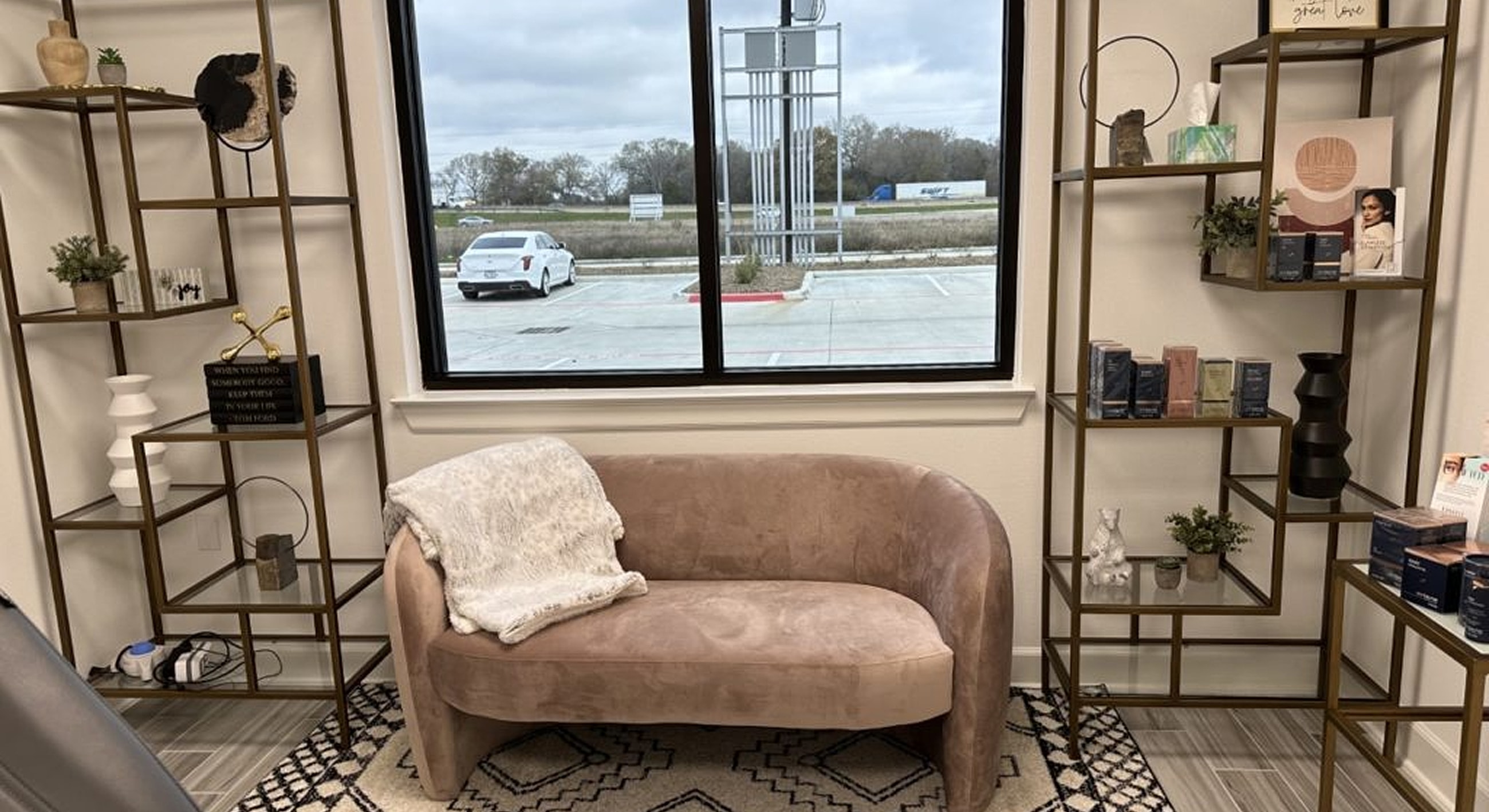 Modern interior with sofa and decorative shelves.