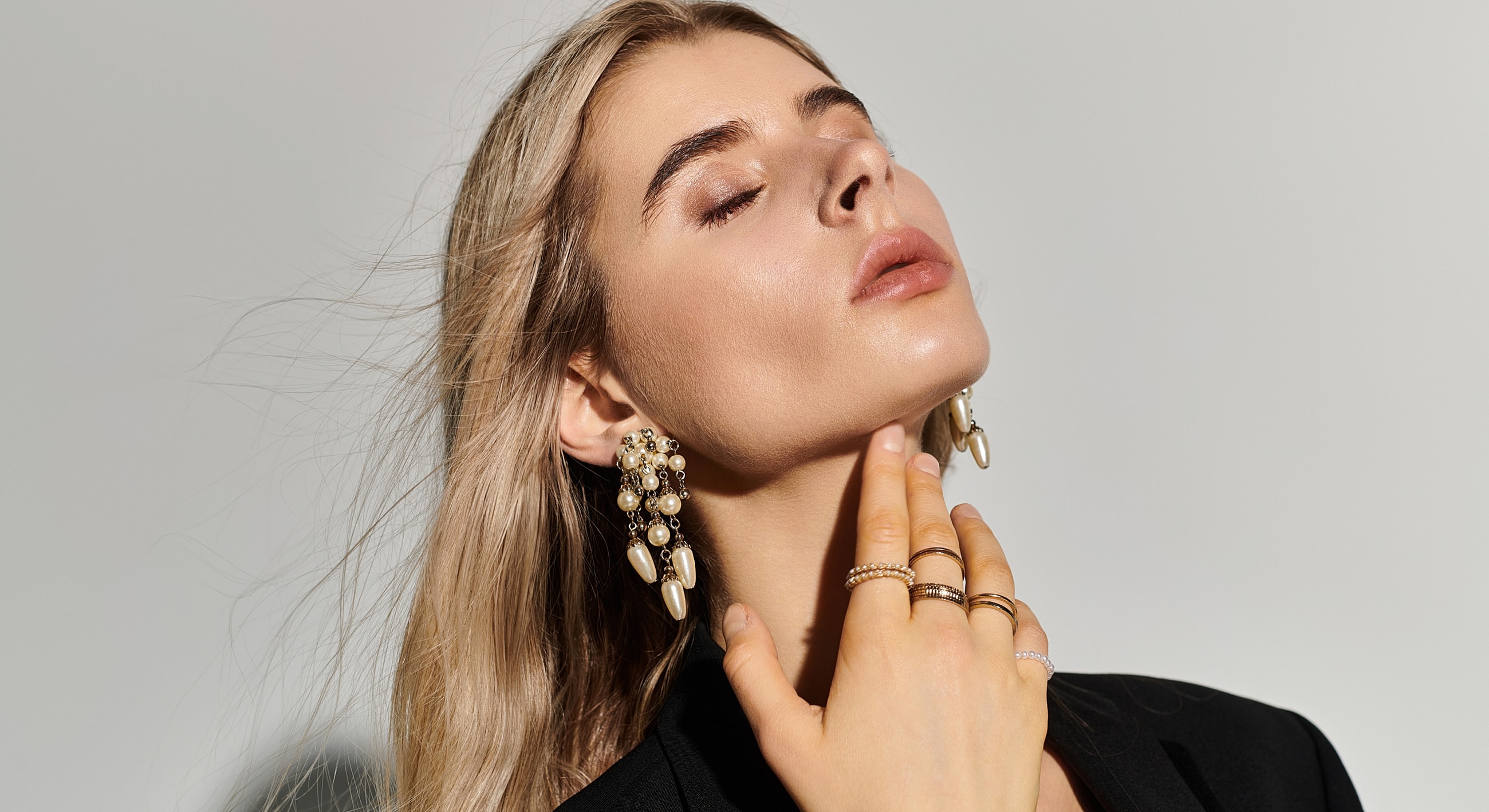 Model showcasing elegant jewelry and accessories.